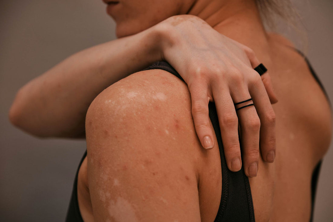 Woman touching her back