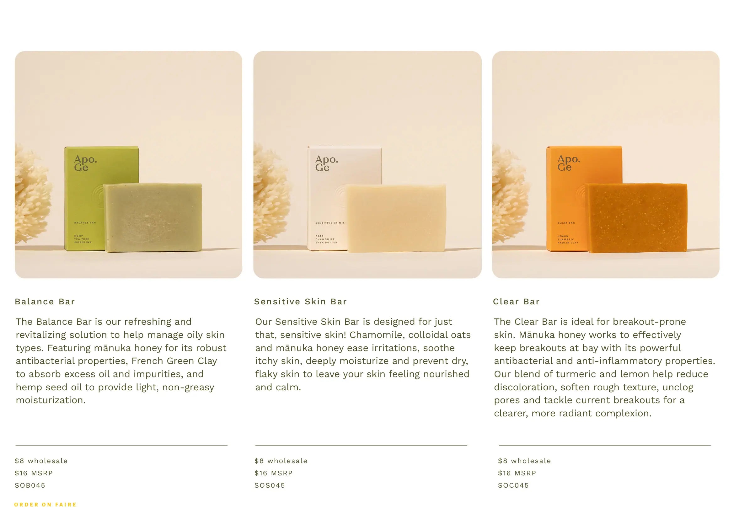 Three soap bars in different colors with packaging on a white background