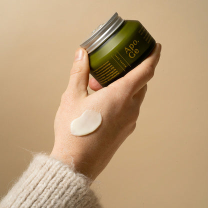 Hand holding Apo.Ge mānuka honey skincare deep hydration face cream.