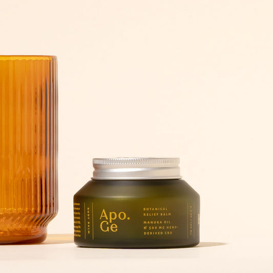 100 ml Green jar of Apo.Ge botanical relief balm with a silver lid on a light background