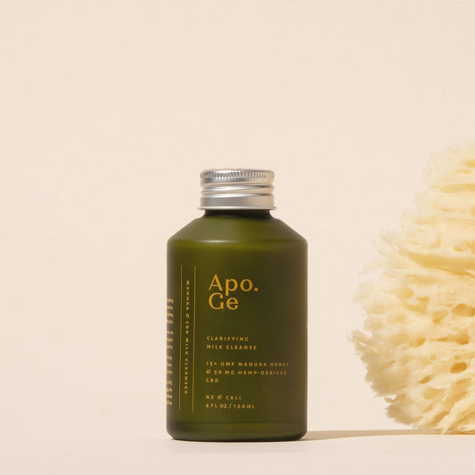apo ge 120ml green glass bottle with silver cap labeled 'Apo.Ge' on a beige background