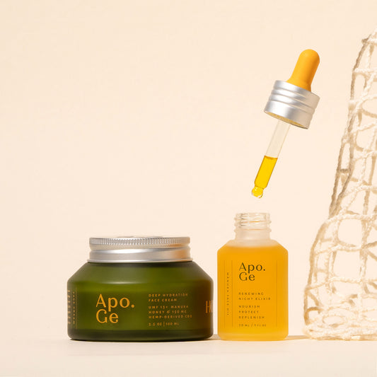 Apo.Ge skincare products including the deep hydration face cream and renewing night elixer bottle on a beige background.