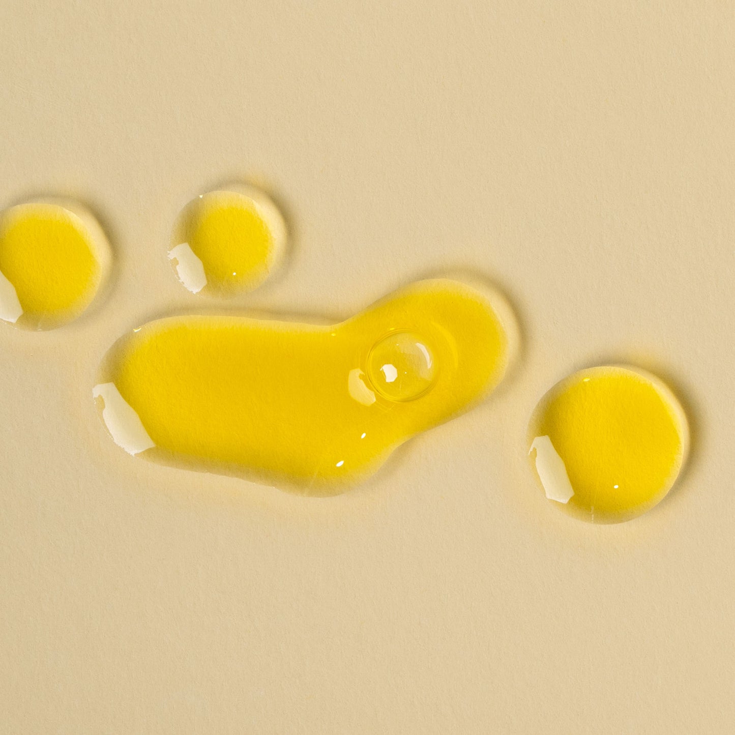 apo ge manuka honey skincare renwing night elixer droplets on a beige background