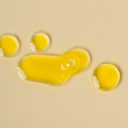 apo ge manuka honey skincare renwing night elixer droplets on a beige background