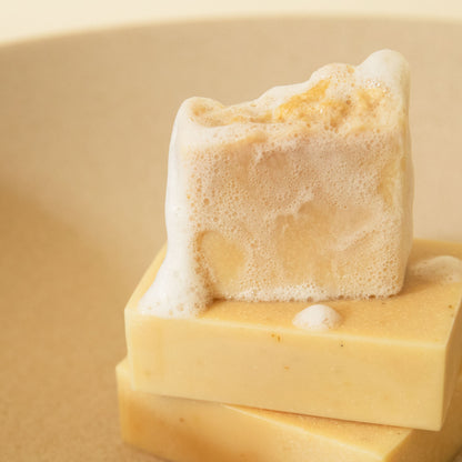 stack of sensative skin bar with soap suds 