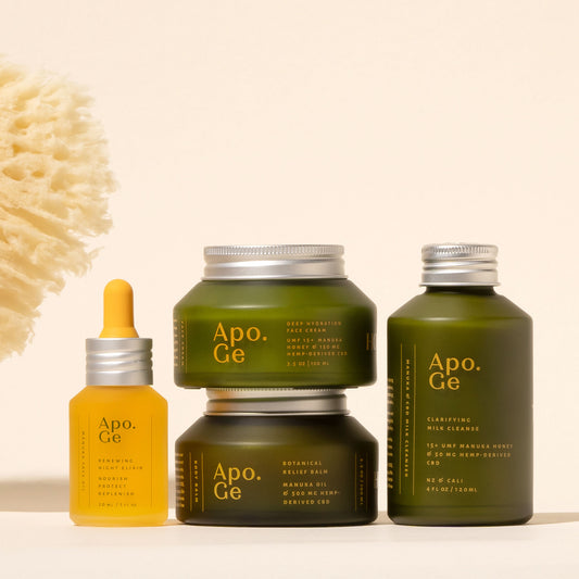 apo ge manuka honey skincare comlete care set featuring the renewing night elixerbotanical relief balm clarifying milk cleanse deepydration face cream on a deigh background
