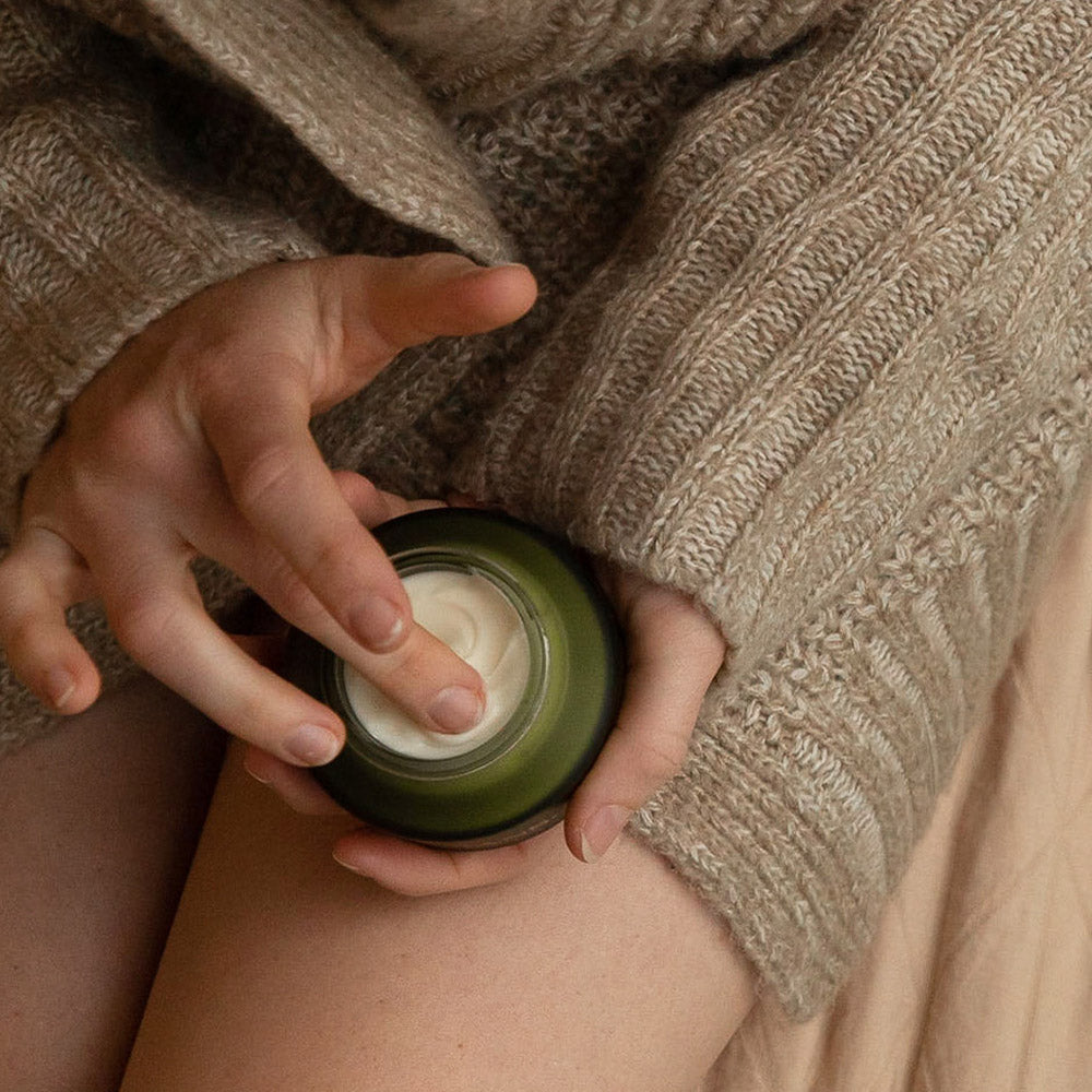 Person holding Apo.Ge deep hydration face cream manuka honey moisturizer