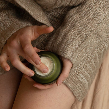 Person holding Apo.Ge deep hydration face cream manuka honey moisturizer